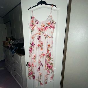 Brand new dress. Beautiful but never worn. To tight on me.